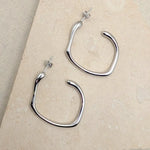 Load image into Gallery viewer, Silver Molten Hoop Earrings
