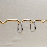 Load image into Gallery viewer, Silver Horseshoe Twist Hoop Earrings
